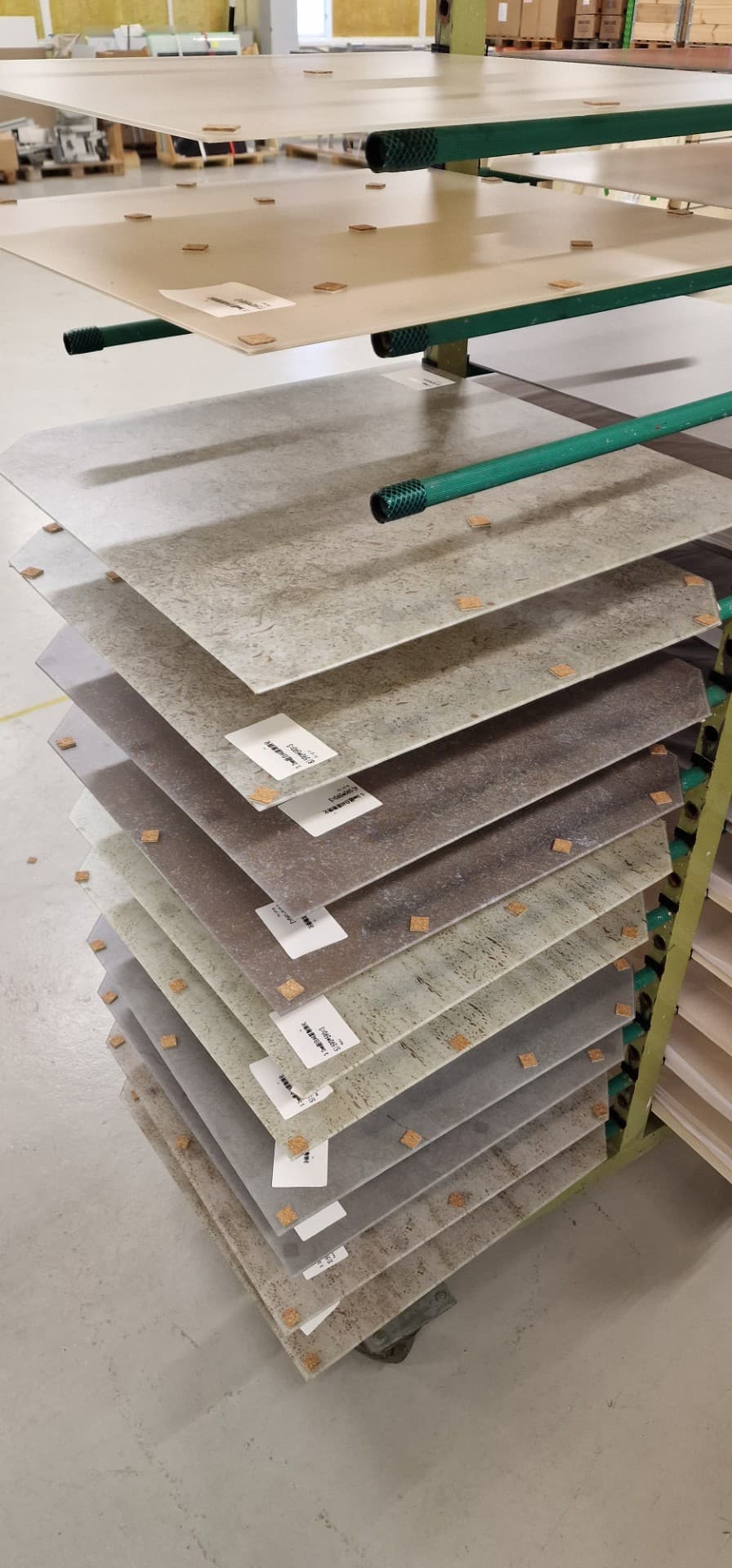 A selection of facade panels in different colours and print variants during production in Elverum